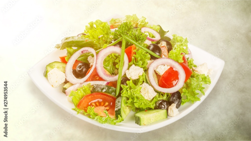 Fresh tasty vegetable salad in bowl on white background Fresh tasty vegetable salad in bowl on white background