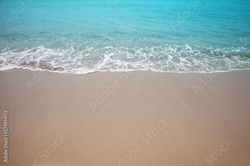 Sand and sea wave. Beach nature background.