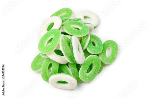 Green gummy candies rings isolated on white. Top view. Jelly sweets.