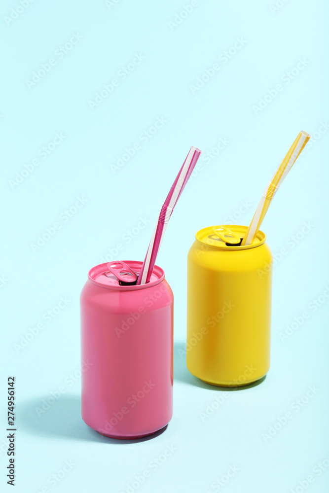 Aluminum can with straws on blue background. Minimalism concept Aluminum can with straws on blue background. Minimalism concept