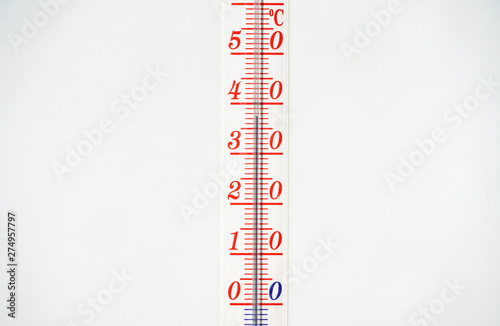 Thermometer during hot weather with solid background