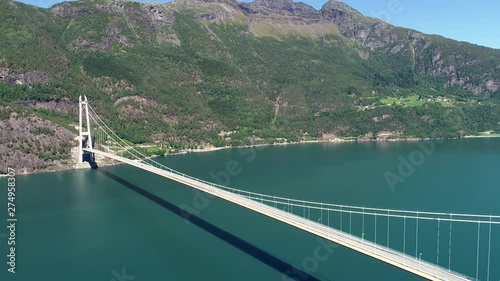 The Hardanger Bridge is a suspension bridge across the Eidfjorden branch of Hardangerfjorden in Hordaland county, Norway. photo