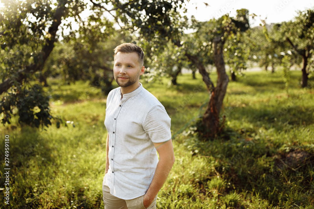Handsome men in the green garden Handsome men in the green garden