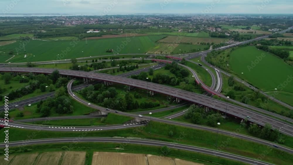 Beautiful countryside landscape with amazing small suburb city and highway road aerial panning shot Beautiful countryside landscape with amazing small suburb city and highway road aerial panning shot