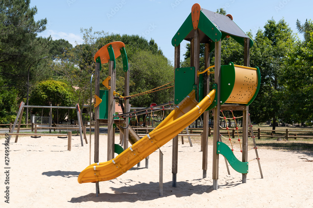 Children colored slides playground on a city park Children colored slides playground on a city park