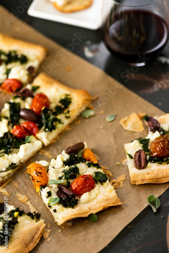 Phyllo Pastry Pizza on Brown Parchment Paper photo