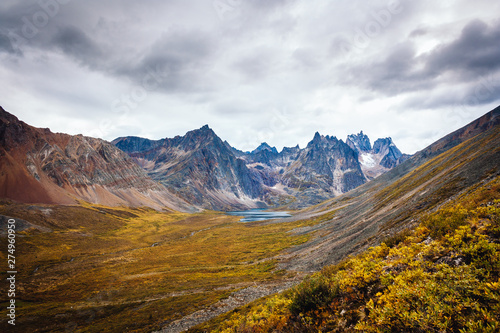 View of the mount Monolith and grizzly lake from the hiking trail of the Tombstone Park in Yukon, Canada. Wide angle shot of the late summer colors. © Yannis