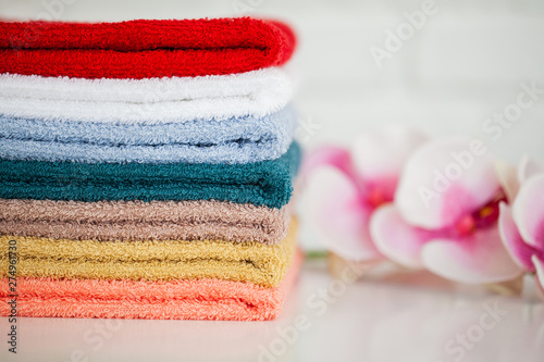 Spa. Colored Cotton Towels Use In Spa Bathroom. Towel Concept. Photo For Hotels and Massage Parlors. Purity and Softness. Towel Textile © Maksymiv Iurii