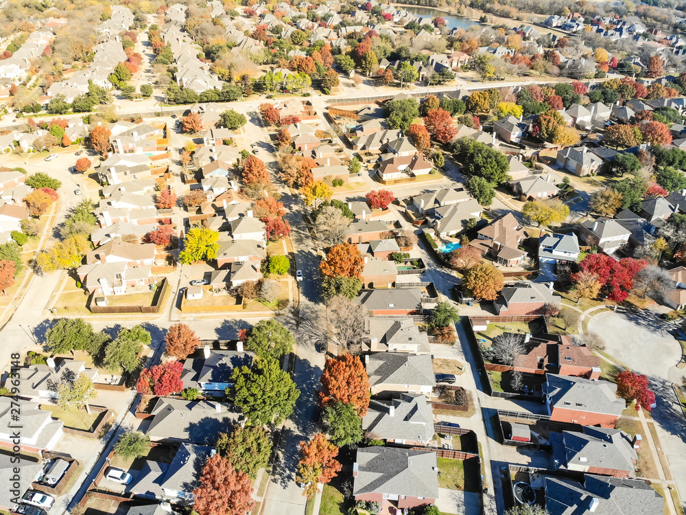 Aerial view residential area with lake and culdesac in autumn near Dallas, Texas