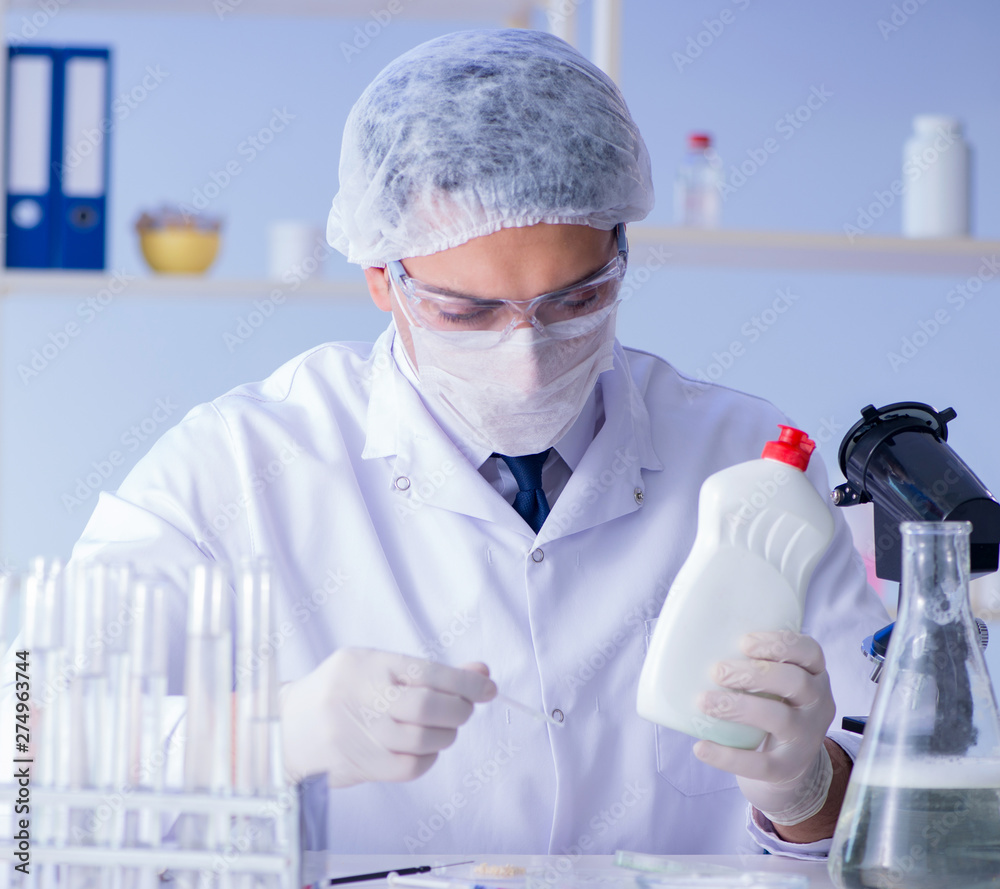 Man in the lab testing new cleaning solution detergent Man in the lab testing new cleaning solution detergent