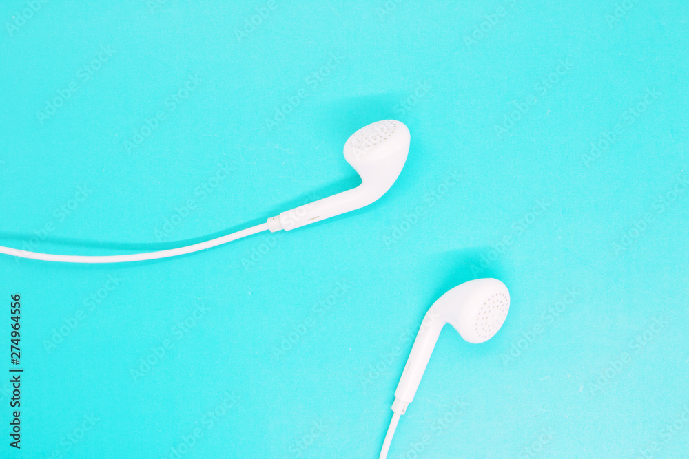 white headphones close up on a turquoise background, headphones for listening to music, modern gadgets, youth accessories white headphones close up on a turquoise background, headphones for listening to music, modern gadgets, youth accessories