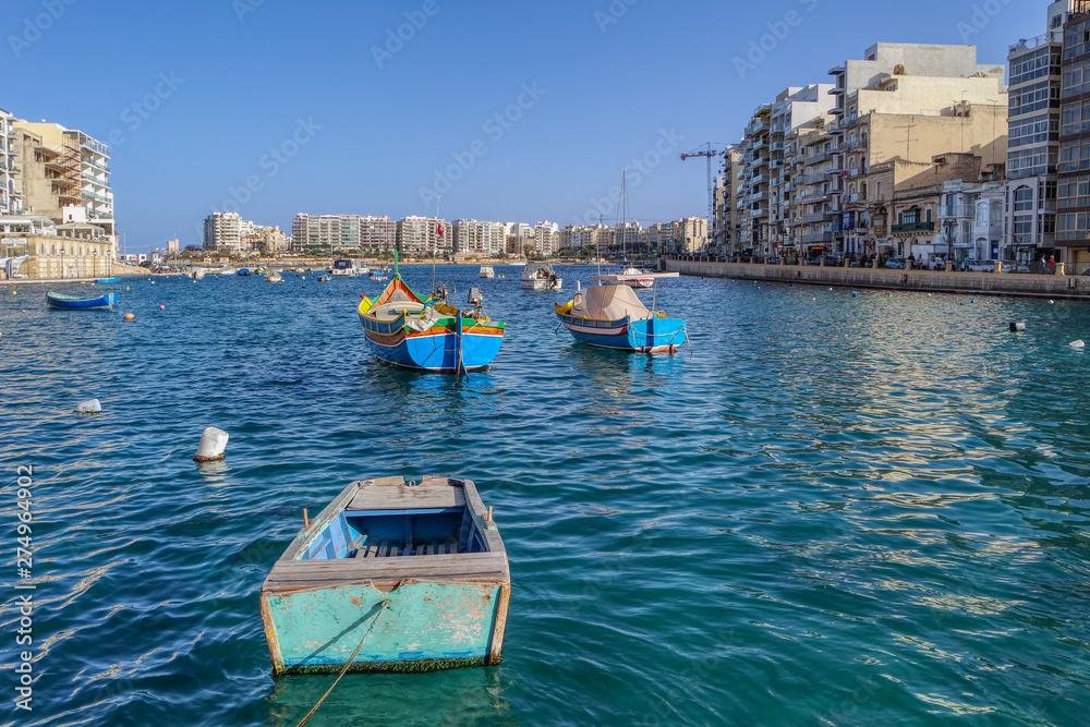View of colorful boats in Spinola Bay, Spinola Harbour, St Julians, Malta