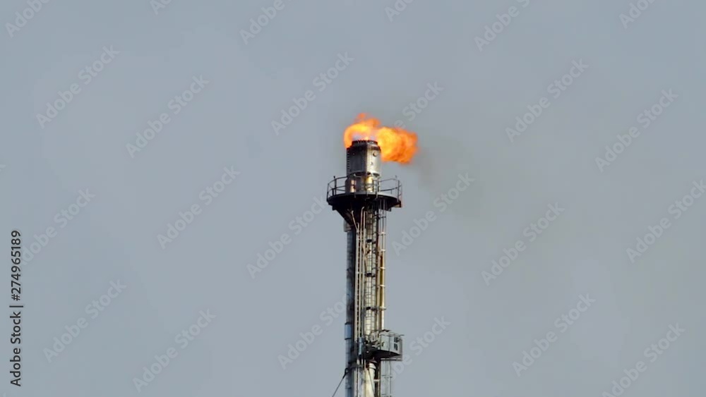Refinery flare - Burning of dangerous gases in the oil field.