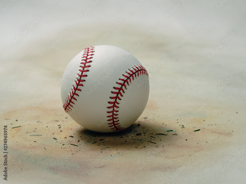Worn and dirty baseball on vintage softly colored organic canvas background
