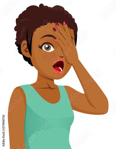 Shy teen black girl covering her face with hand surprised