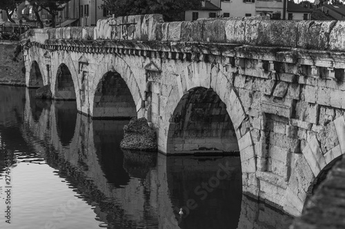 Bridge of Tiberius in Rimini at sunset, Italy.