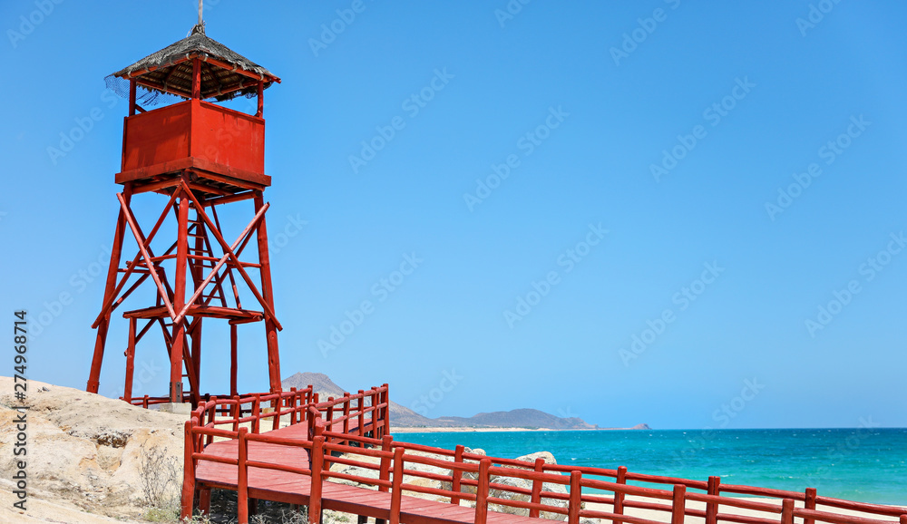 Red tower on the beach in Mexico. 