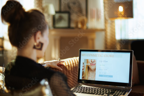 elegant woman making beauty makeup online shopping photo