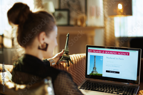 woman with Eiffel tower search hotel on online booking website
