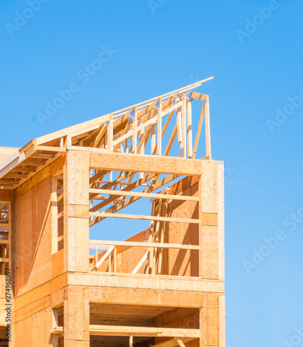 New apartment building under construction on sunny day on blue sky background
