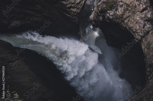 View closeup waterfall of Trmmelbach fall in mountains, valley of waterfalls photo