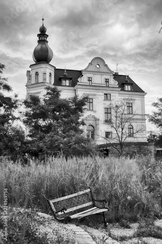 WROCLAW, POLAND - JUNE 21, 2019: Palace in Biskupice Podgorne near Wroclaw, Poland. Cloudy sky on the last day of spring. photo