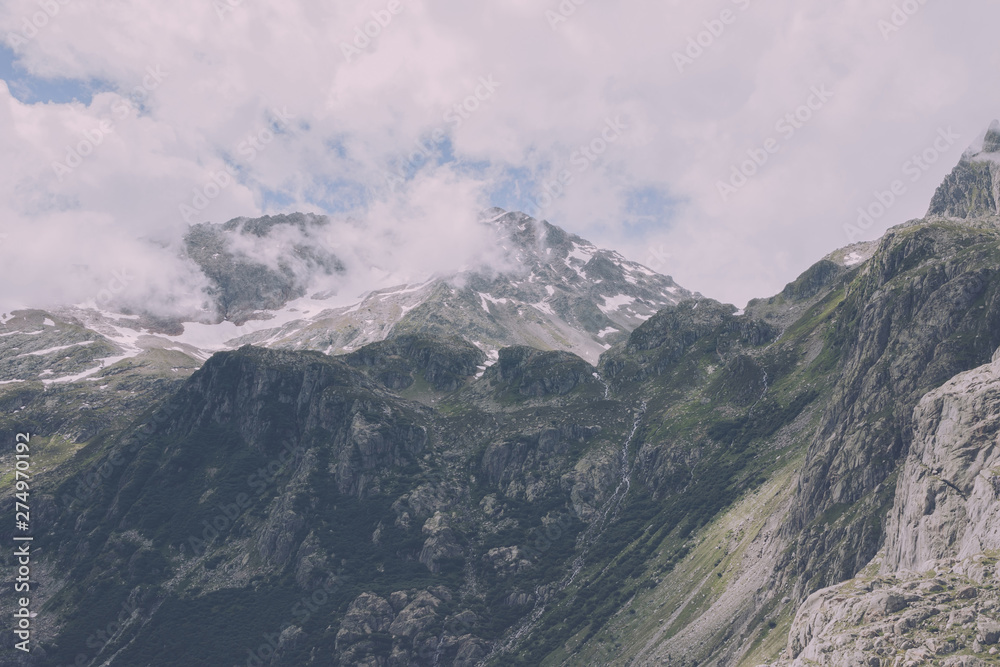Closeup mountains scenes, walk to Trift Bridge in national park Switzerland Closeup mountains scenes, walk to Trift Bridge in national park Switzerland