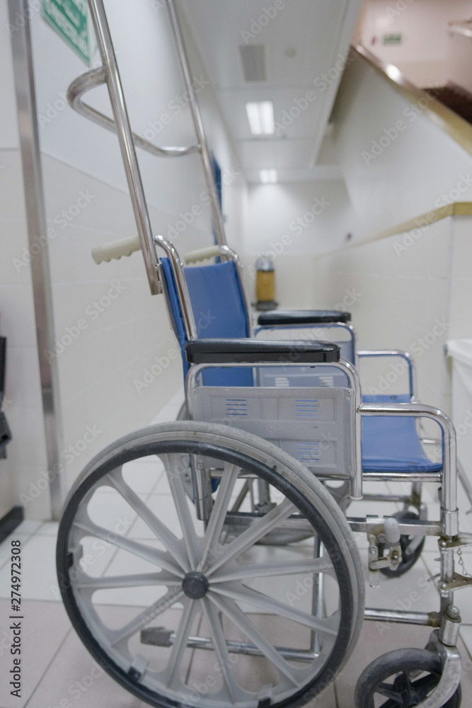 A wheelchair in the corridor of the hospital.