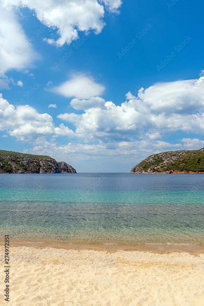 Landscape with beach, the sea and the clouds in the blue sky Landscape with beach, the sea and the clouds in the blue sky