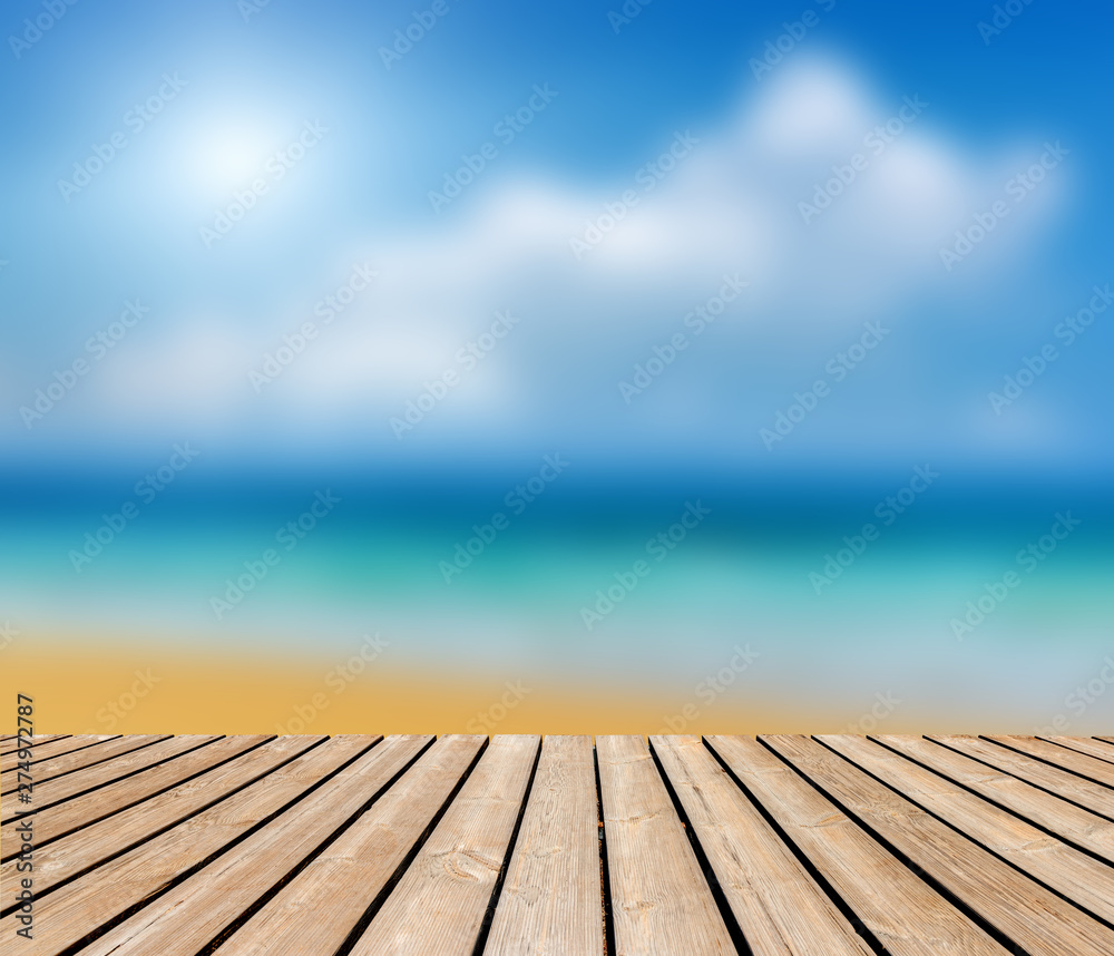 Empty wooden table and beach blurred background