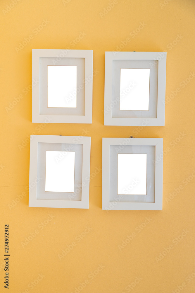 Blank photo frame on yellow wall template.Photo frame decorative mock up. Blank photo frame on yellow wall template.Photo frame decorative mock up.