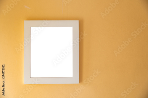 Blank photo frame on yellow wall template.Photo frame decorative mock up.