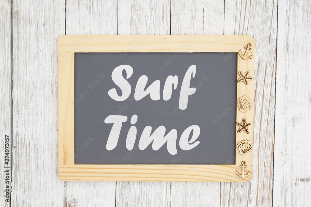 Fototapeta premium Surf time text on a chalkboard with nautical objects
