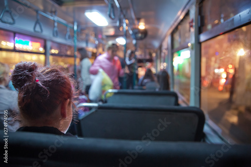 People in old public bus, view from inside the bus . People sitting on a comfortable bus in Selective focus and blurred background. s the main mass transit passengers in the bus.