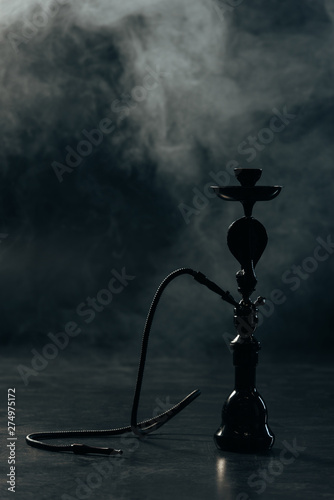 black hookah stem and hose in grey smoke