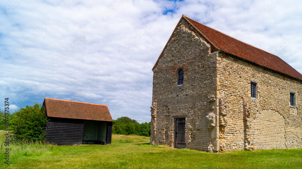 Looking at the nave of St Peter's 7th-century chapel, Bradwell-on-Sea, built of reused Roman materials on the entrance of Othona Roman fort Looking at the nave of St Peter's 7th-century chapel, Bradwell-on-Sea, built of reused Roman materials on the entrance of Othona Roman fort