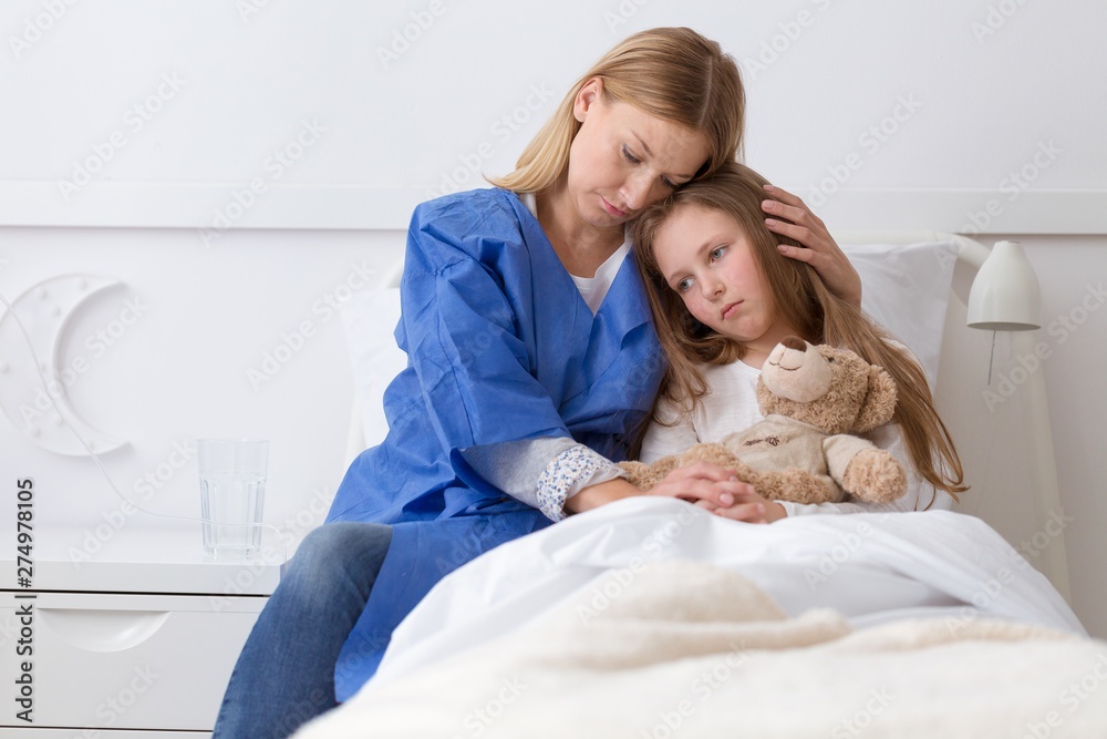 Sick sad girl and afraid mother in the hospital Sick sad girl and afraid mother in the hospital
