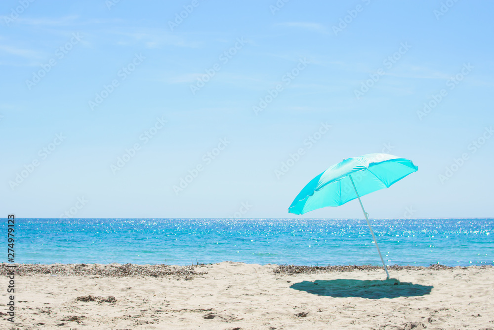 Sun umbrella on the sandy beach.