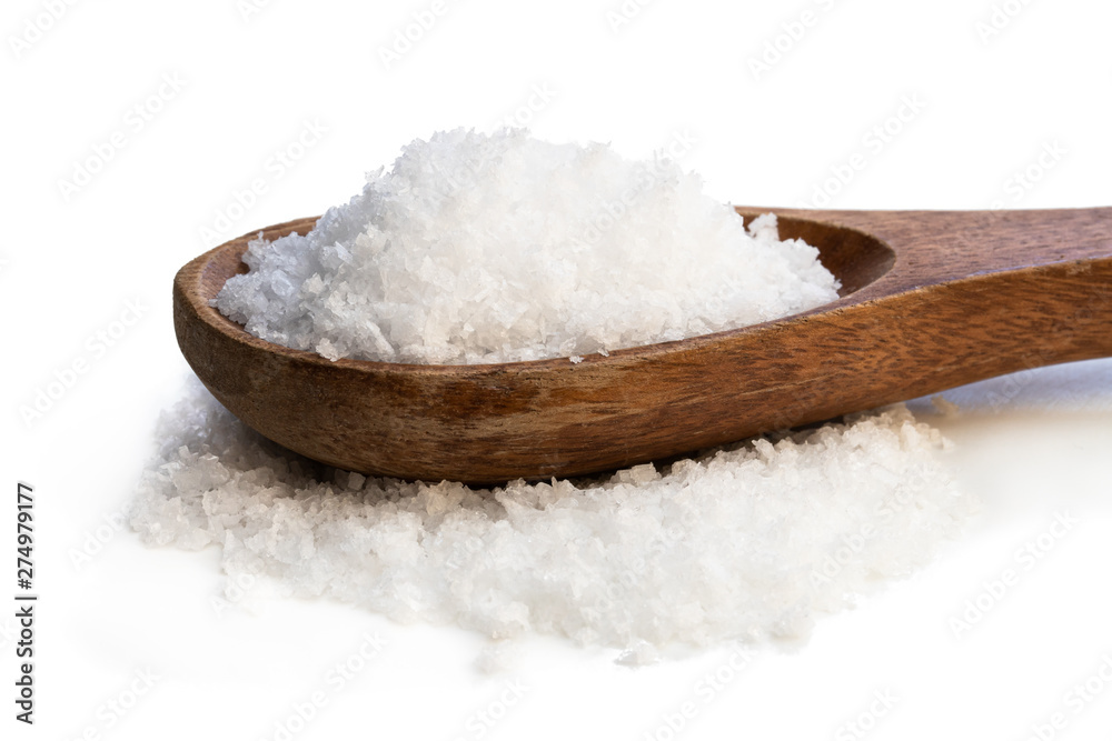 Wooden spoon with sea salt isolated on white Wooden spoon with sea salt isolated on white