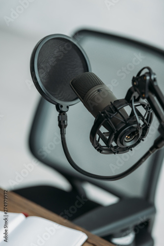 professional microphone with membrane at workplace in broadcasting studio © LIGHTFIELD STUDIOS