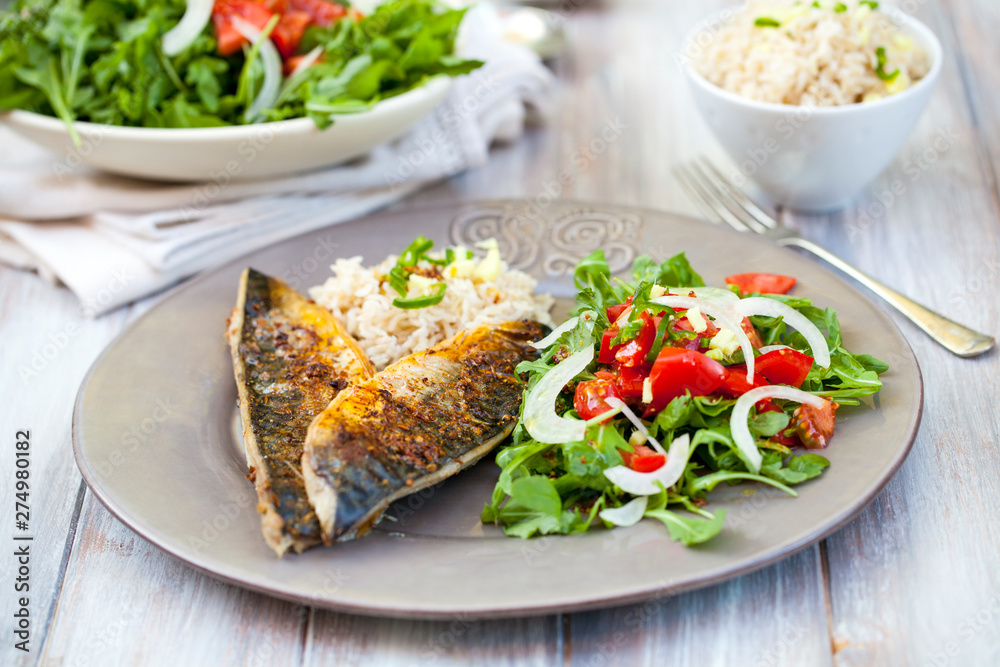 Grilled mackerel with rice and salad Grilled mackerel with rice and salad