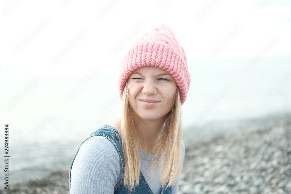 Portrait of beautiful blond girl in wool hat Portrait of beautiful blond girl in wool hat