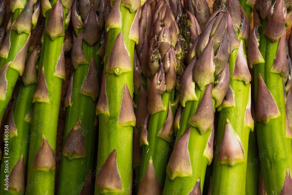 Texture of close-up asparagus. For posting cooking headlines. gastronomy diets and vegetarians Texture of close-up asparagus. For posting cooking headlines. gastronomy diets and vegetarians