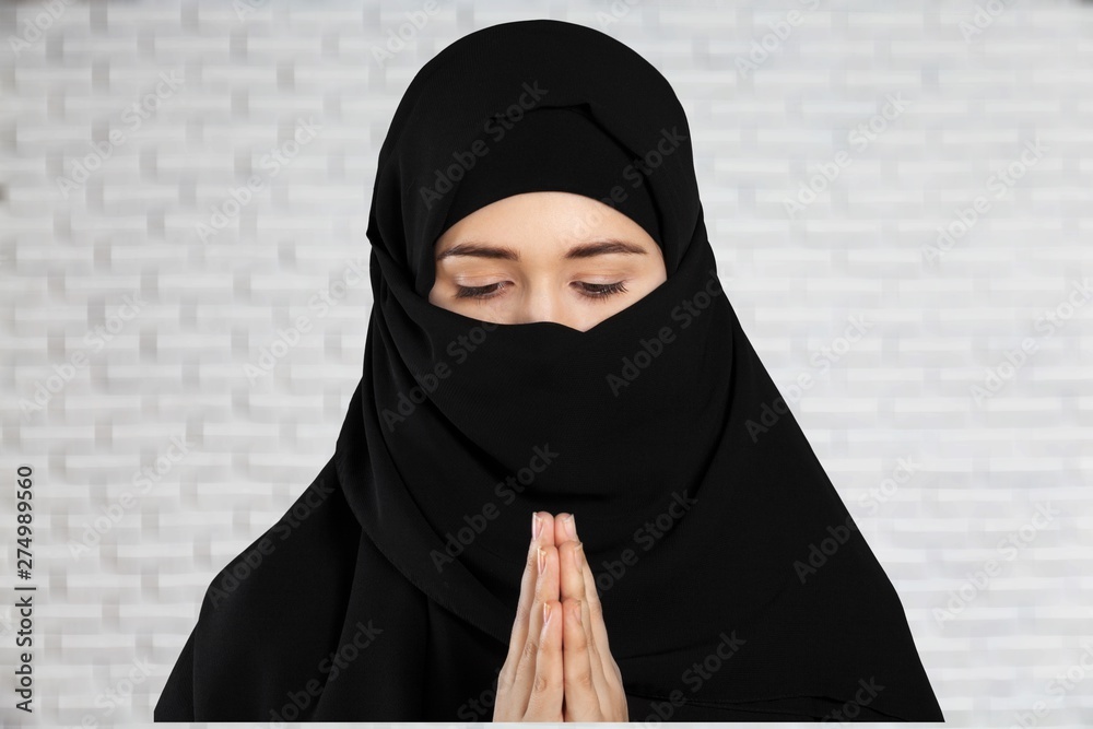 Mysterious Arabian woman on background Mysterious Arabian woman on background