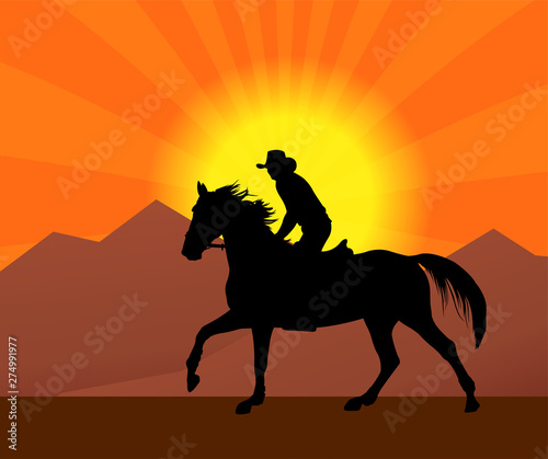 cowboy riding a horse in a sunset silhouette