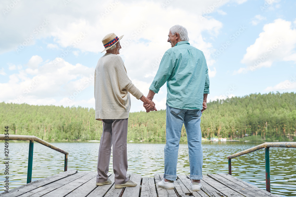 Happy amorous senior spouses in casualwear