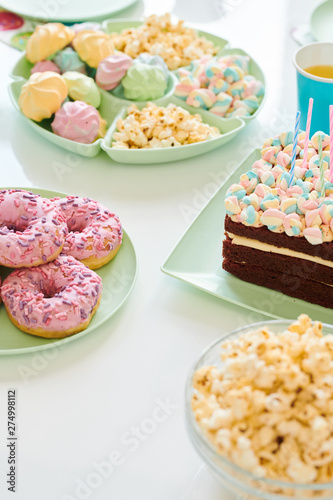 Birthday desserts on served table © pressmaster