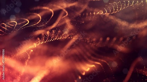 complex golden composition with luminous particles that form wavy structures in the air. 4k 3d looped smooth animation with glow paricles. sci-fi microworld or space background. 28 photo