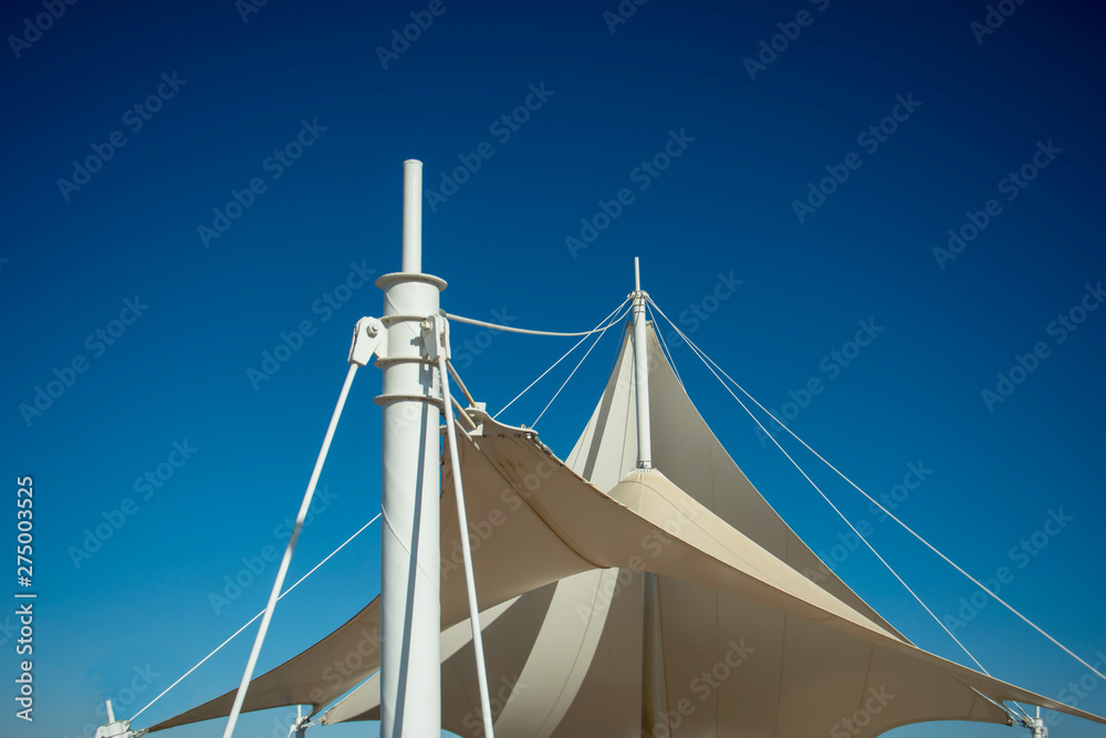 Fototapeta premium The white arbor was set against a blue sky