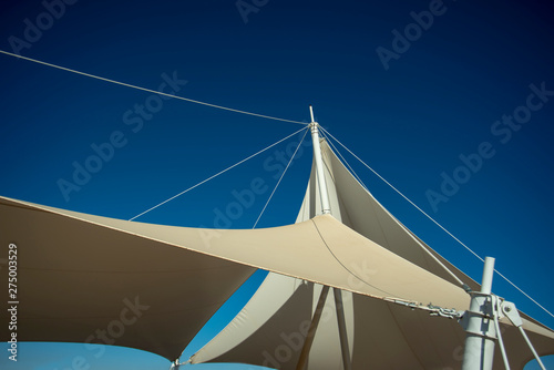 The white arbor was set against a blue sky